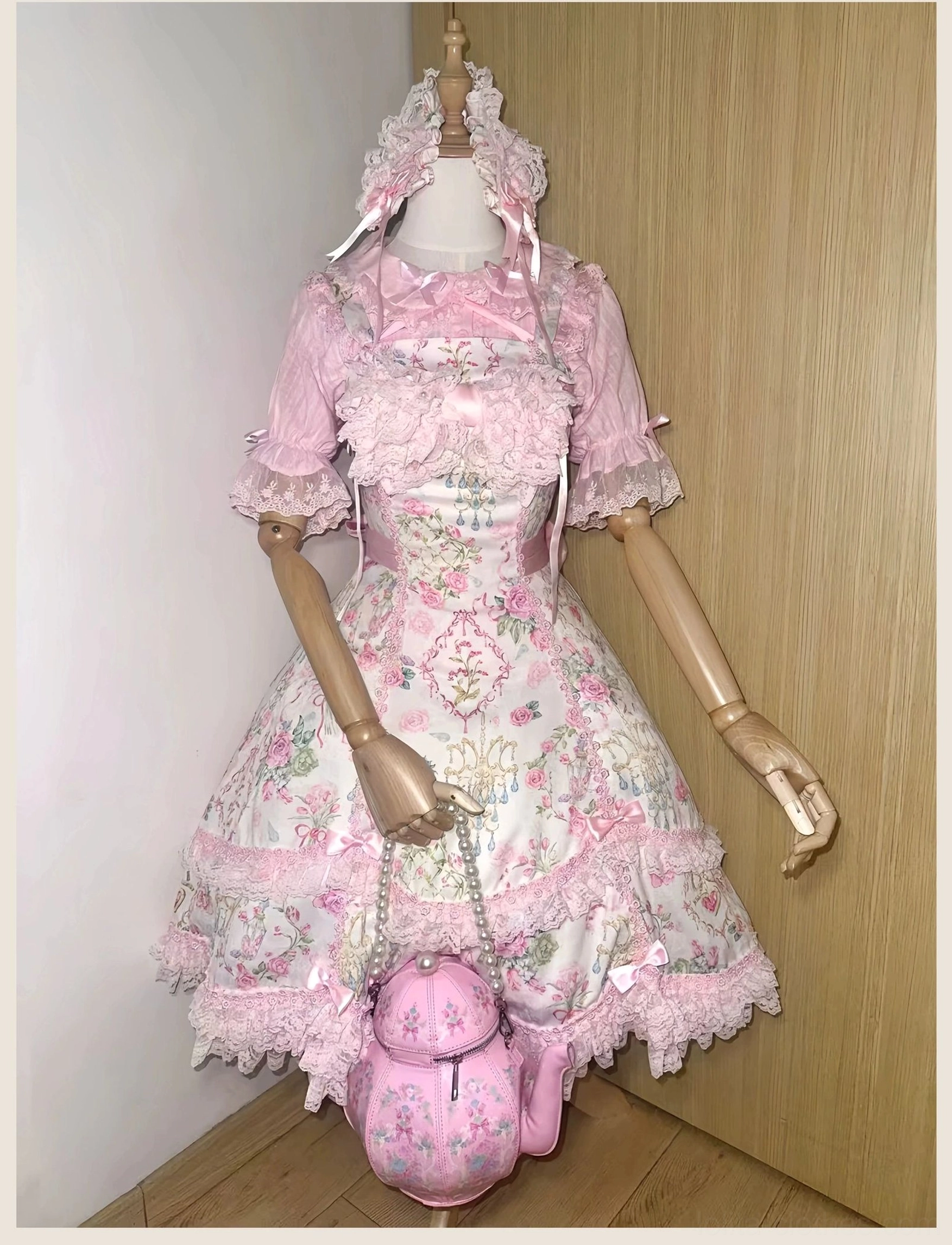 Floral old school Lolita JSK dress three-quarter front view with ruffled lace collar, A-line silhouette, teapot-shaped handbag and detailed print