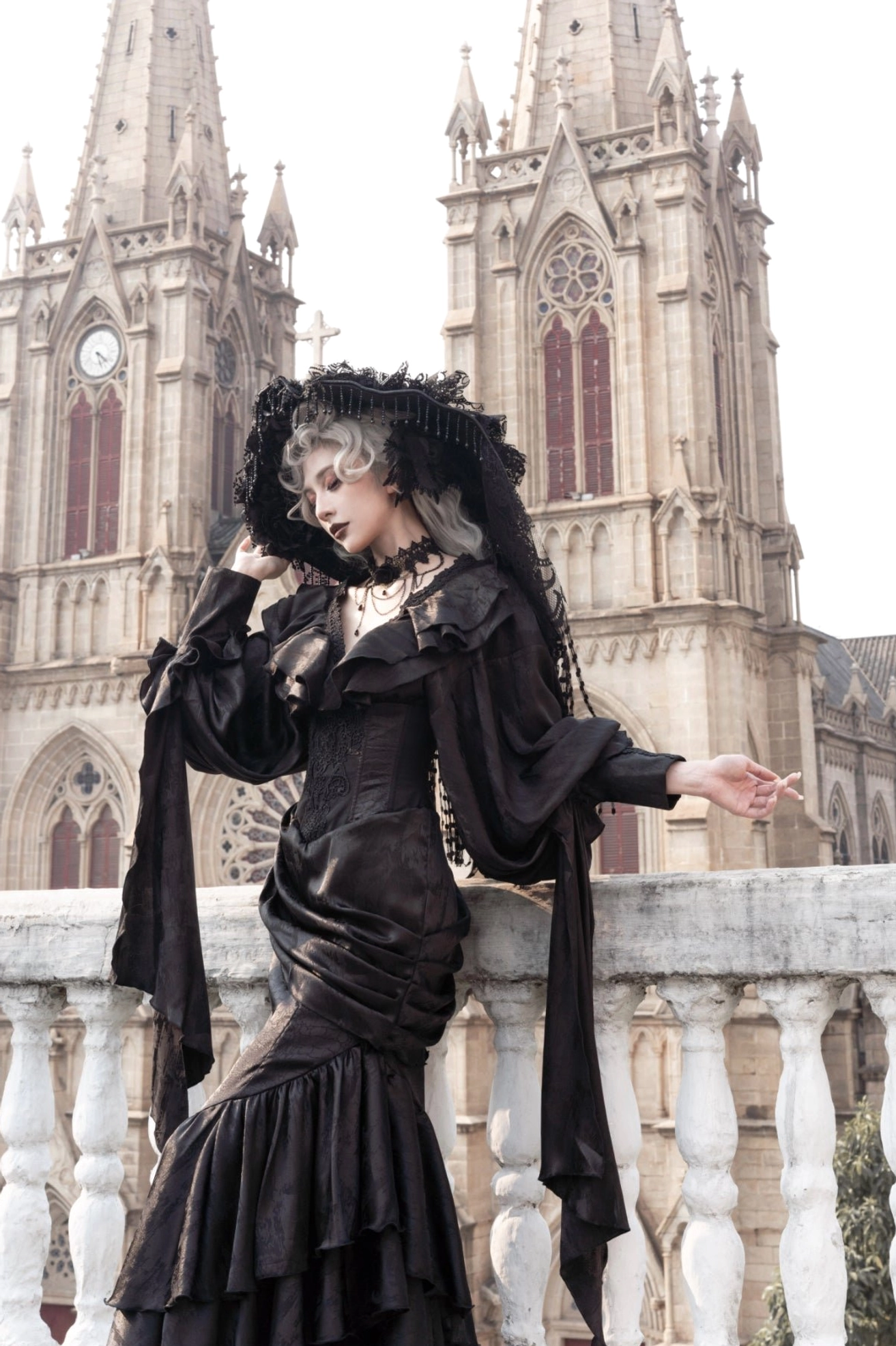 Oracle black gothic lolita mermaid skirt three-quarter front view displaying fitted corset and wide detached sleeve flaps