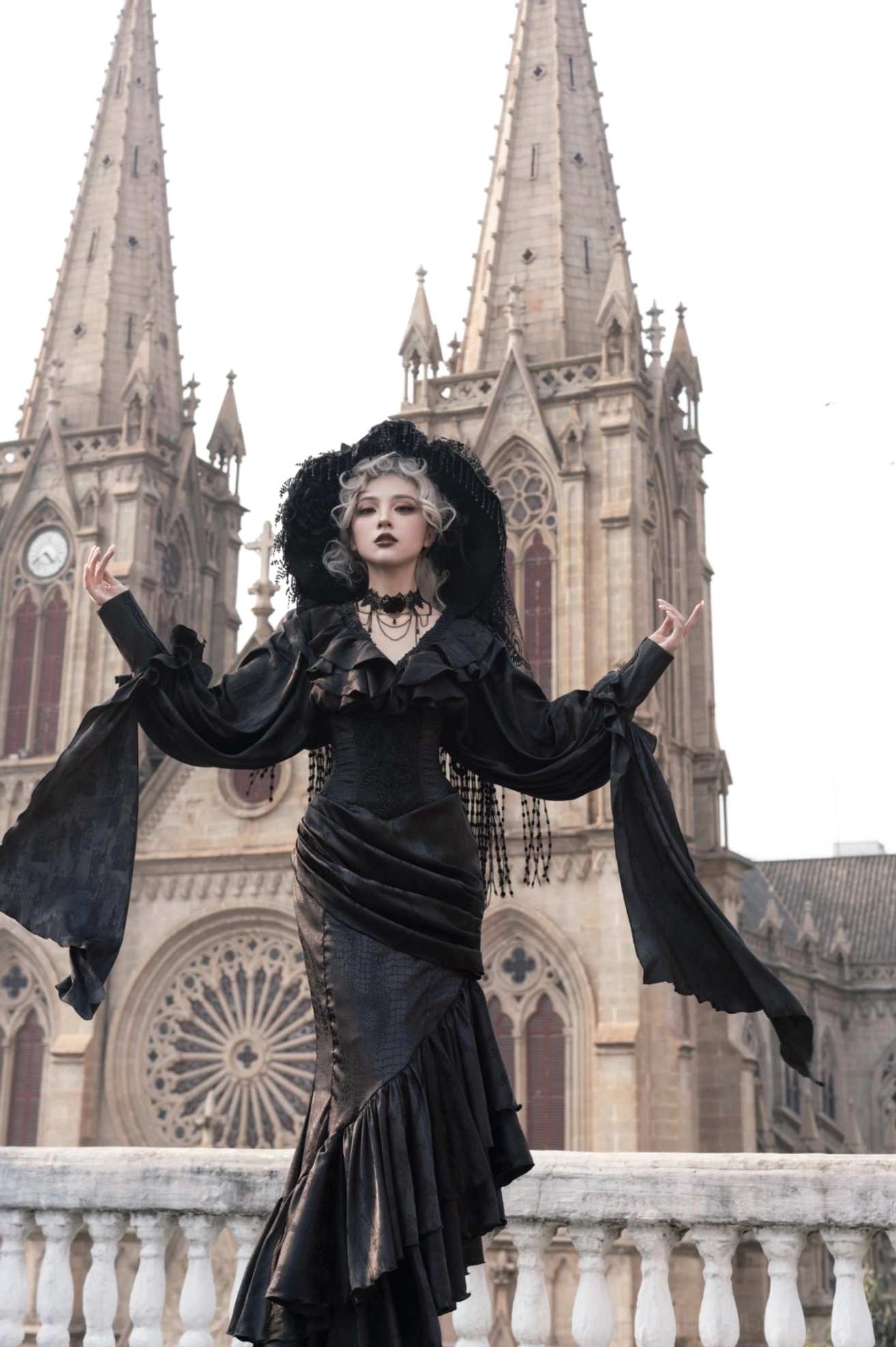 Oracle black mermaid gothic lolita skirt full frontal pose at cathedral showing dramatic draped silhouette and choker