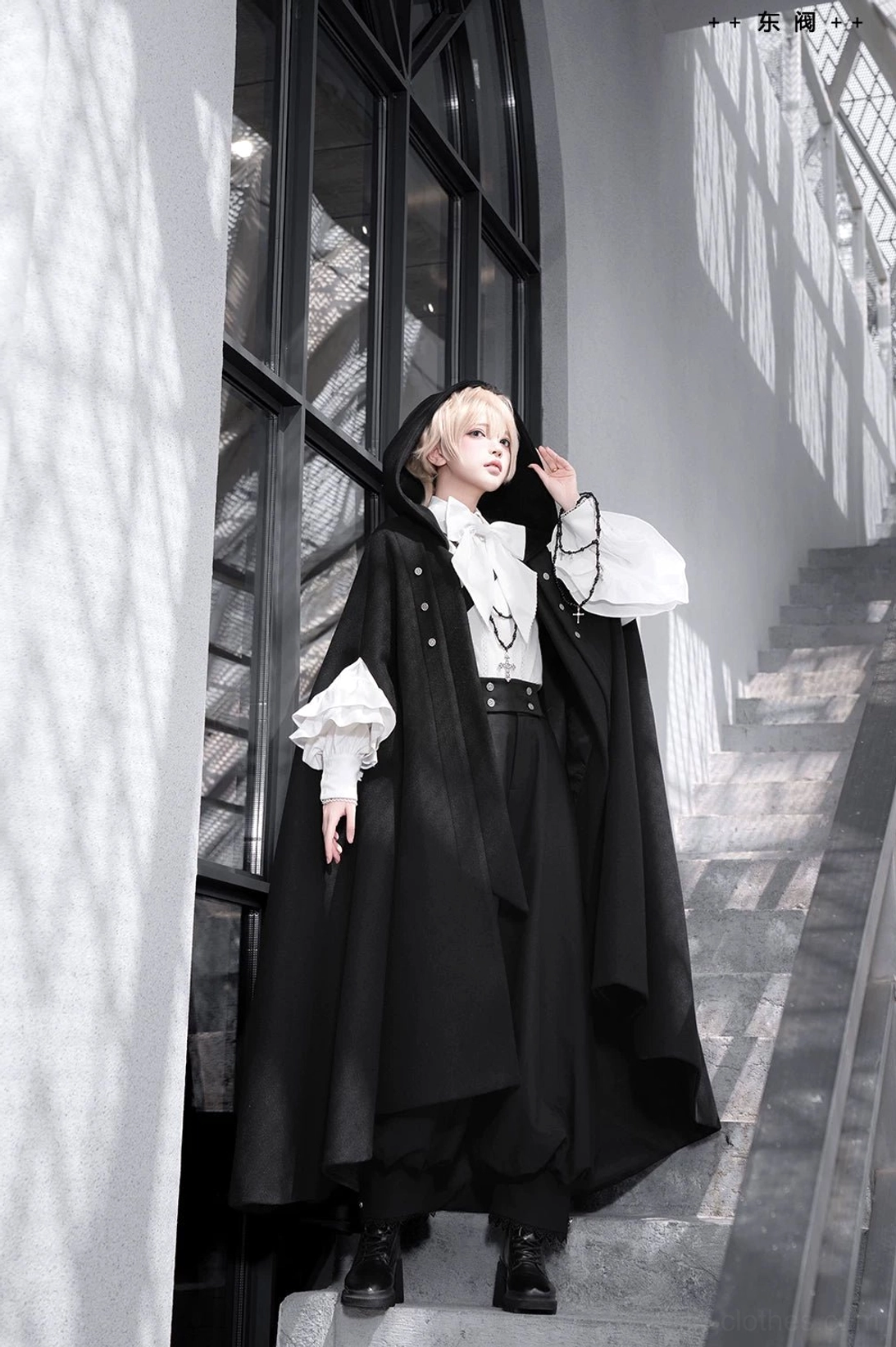 Ouji blouse ruffled sleeve detail close-up showing scalloped trim placket double-layered ruffle construction