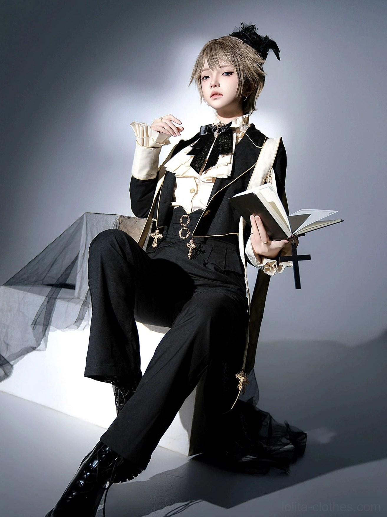 Prince lolita formal suit set sitting pose low angle androgynous model wearing black formal trousers leather boots