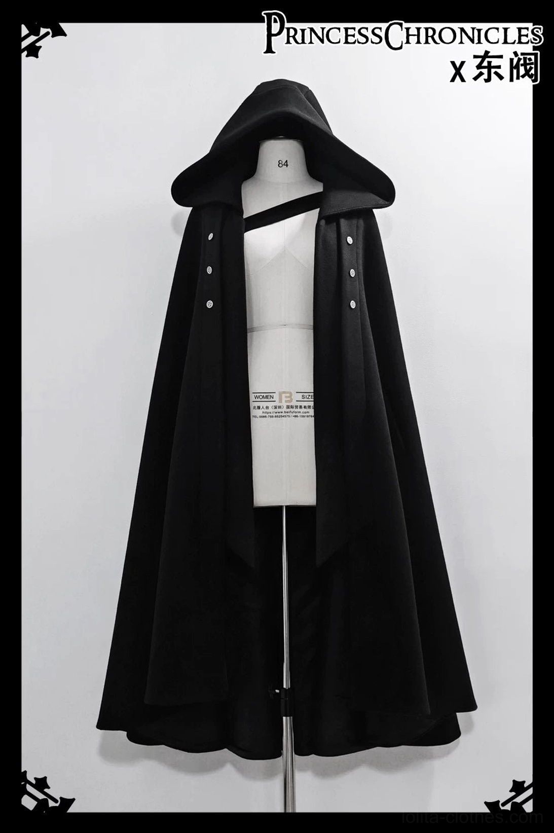 Single hooded cape front view dress form display open front black hooded cloak matte woven fabric button decorations