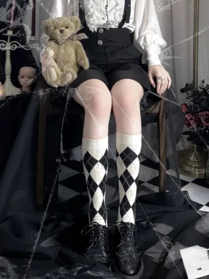 full-front-view-ouji-lolita-model-wearing-black-cream-argyle-calf-socks-with-gothic-overalls-vintage-teddy-bear-decor