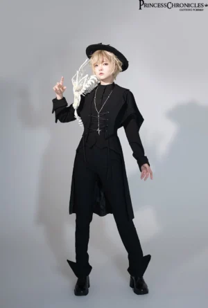 Male model wearing complete Ouji Gothic Lolita suit with black flat top hat, stand collar blazer, skeleton prop, full body front view