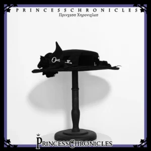 Ouji Lolita black flat top hat with metal buckle and 3D flower ornament, front display view on vintage wooden hat stand, gothic retro style headdress