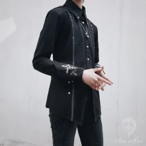 Ouji lolita black gothic shirt side three-quarter view showcasing tailored slim fit, silver decorative piping along front placket, and layered hem design on male model