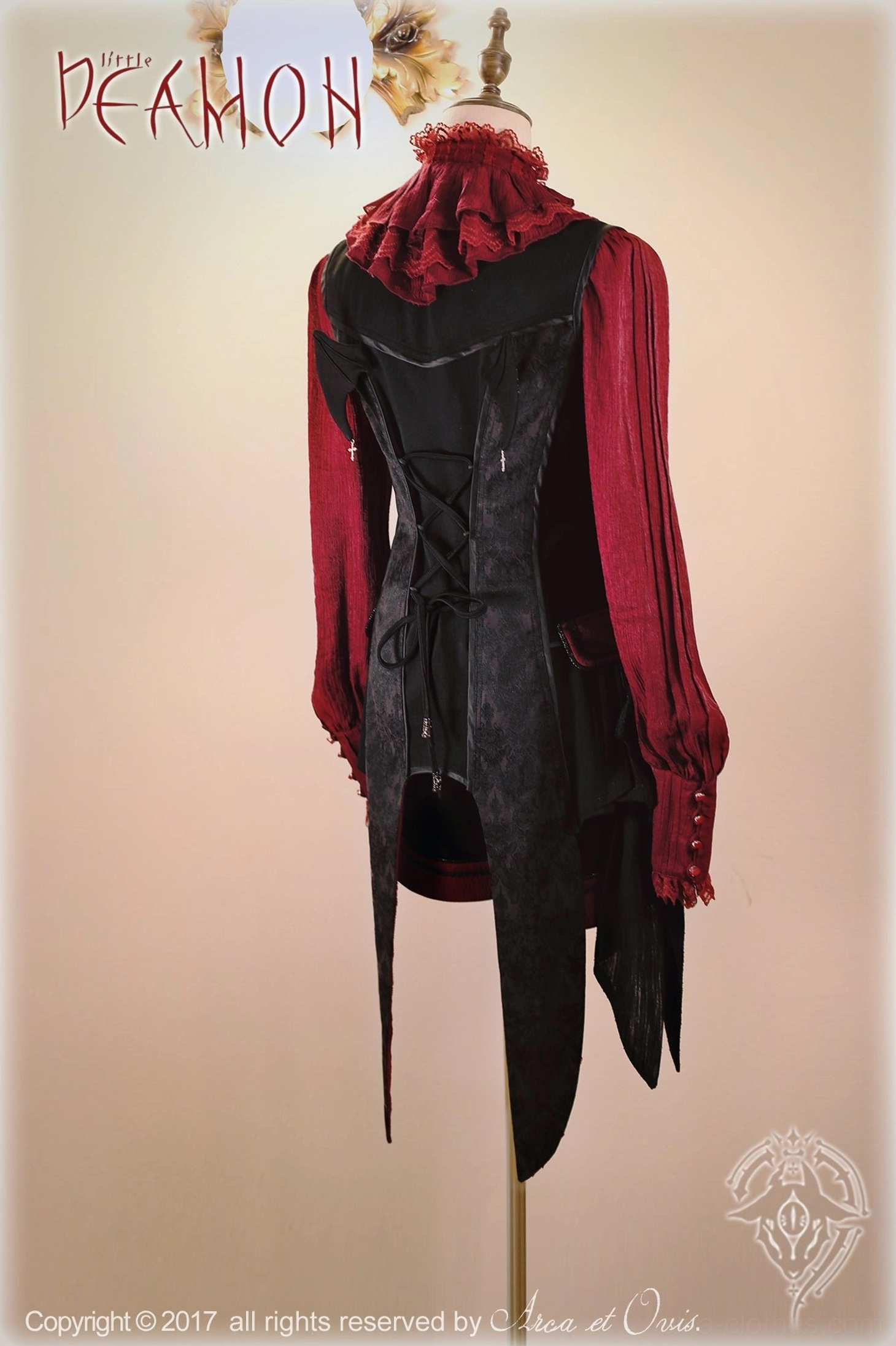 Back view of Ouji lolita blouse showing contrasting red sleeves, black back panel and functional corset lacing with ruffled collar detail