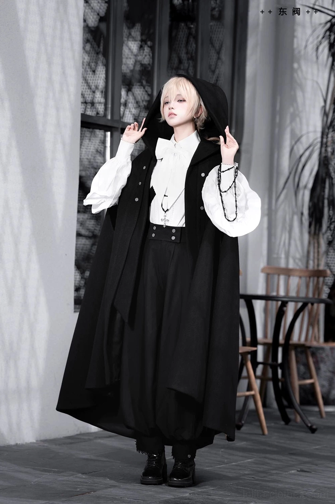 Ouji lolita ensemble detail shot showcasing cape hood structure fabric texture and construction quality