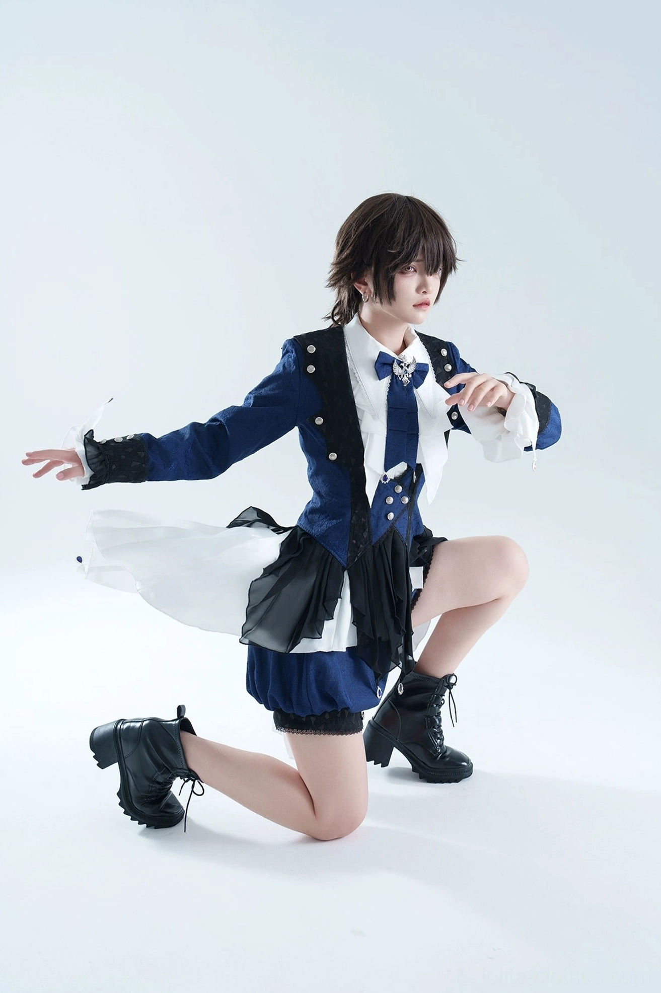 Ouji lolita coat set kneeling side view dynamic pose asymmetrical back train ruffled shirt accents tailored