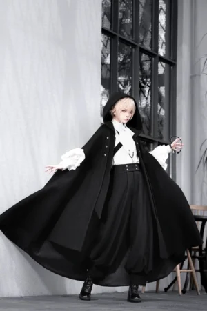Ouji lolita three-piece set full-body front view worn by blonde model in studio with dramatic black hooded cape blouse and high-waisted pants