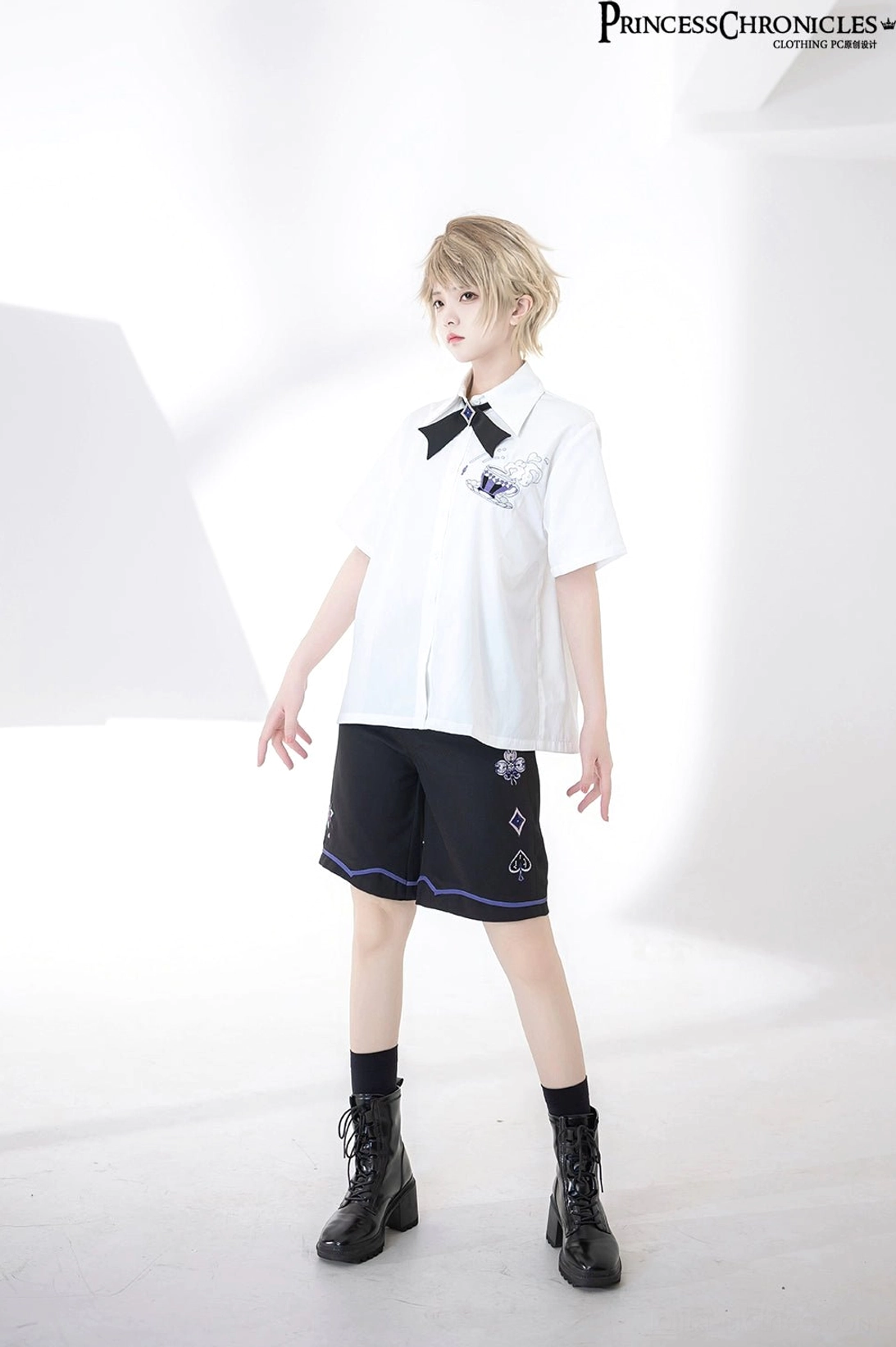 Front standing full-body view of ouji lolita coordinate with embroidered short-sleeve white shirt black socks combat boots alternative fashion