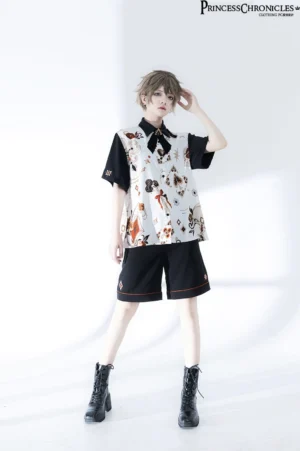 Ouji Lolita two-piece outfit side profile showing back printed motifs, worn with black combat boots by androgynous male model in white studio