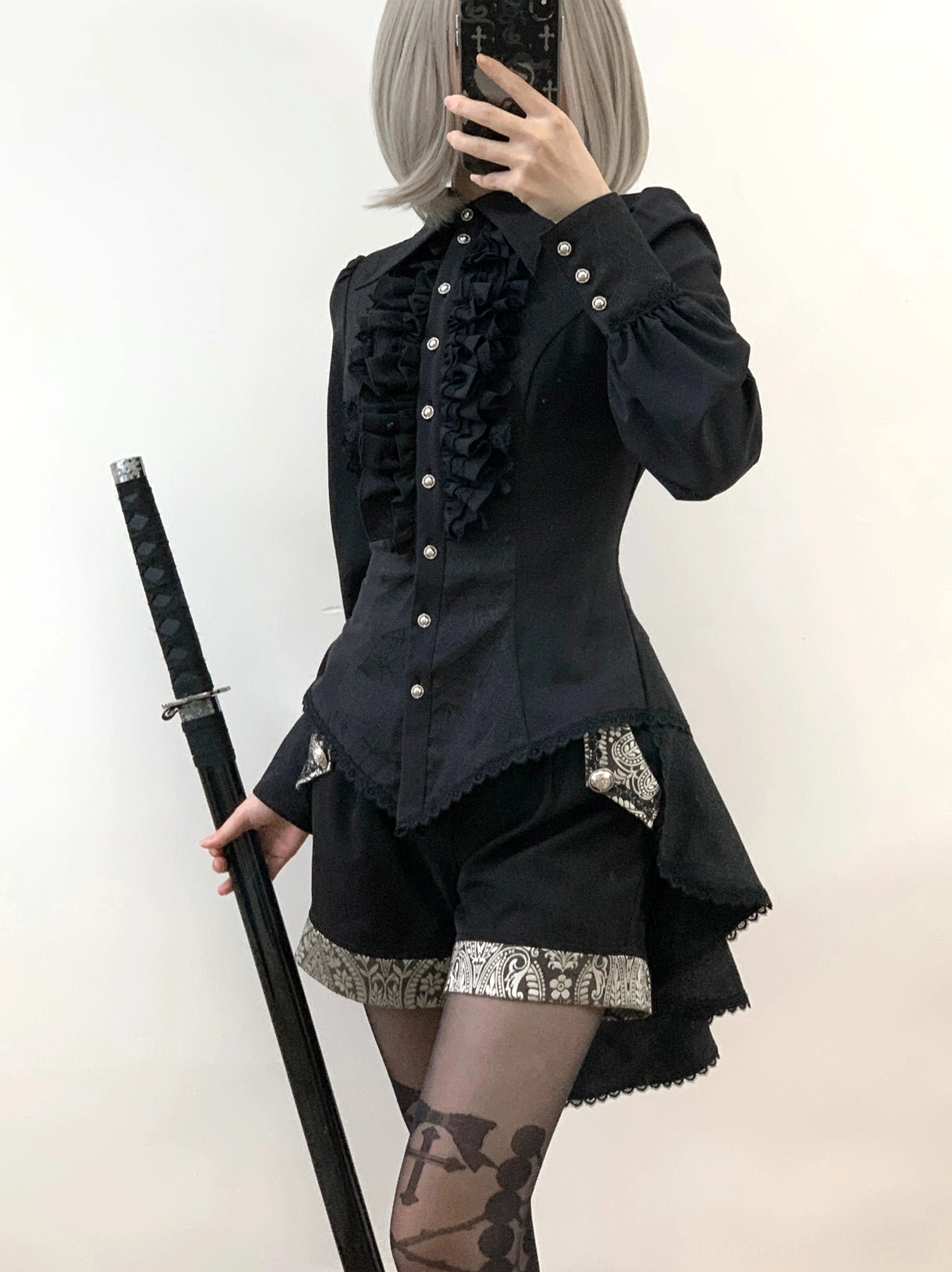 Gothic Ouji lolita spiderweb shirt collar detail showing pointed neckline construction spiderweb pattern and lace collar treatment
