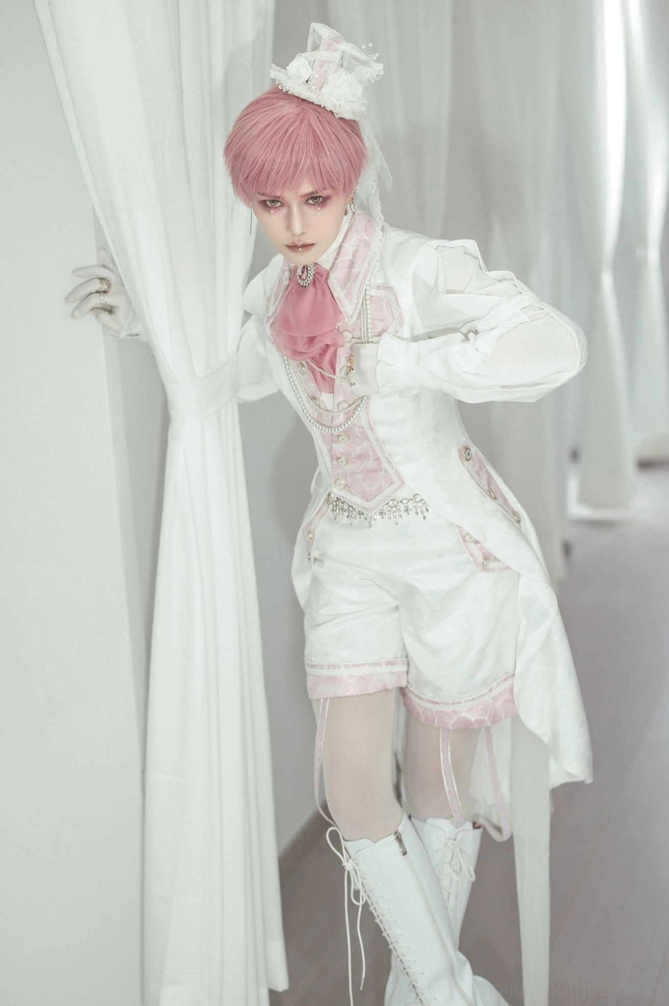 Pink-white Ouji Lolita sleeveless tailcoat front view worn by male model with ruffled collar and matching shorts