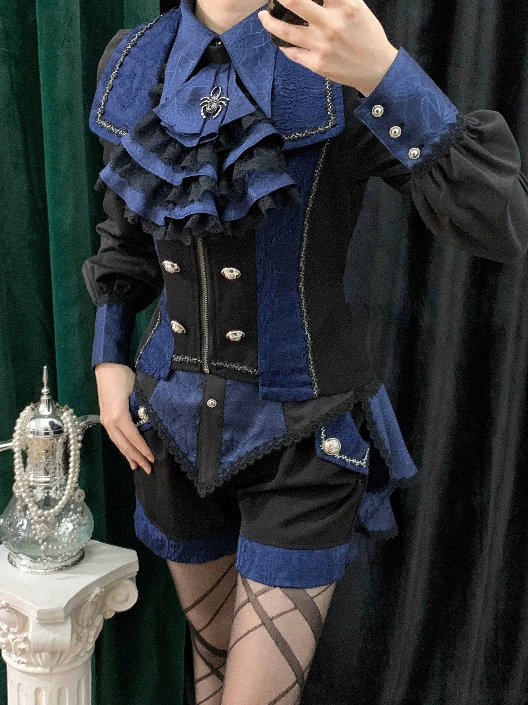 Black gothic Ouji lolita spiderweb shirt detail showing pocket square placement decorative hip patches and side seaming construction
