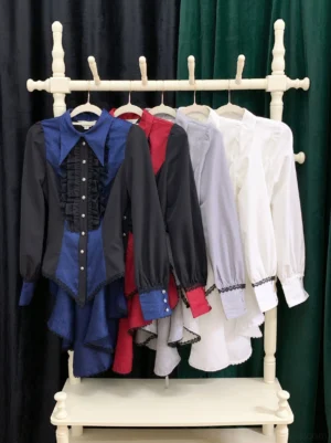 Multiple color variants of gothic Ouji lolita spiderweb shirt collection navy black red purple white hanging display on rack