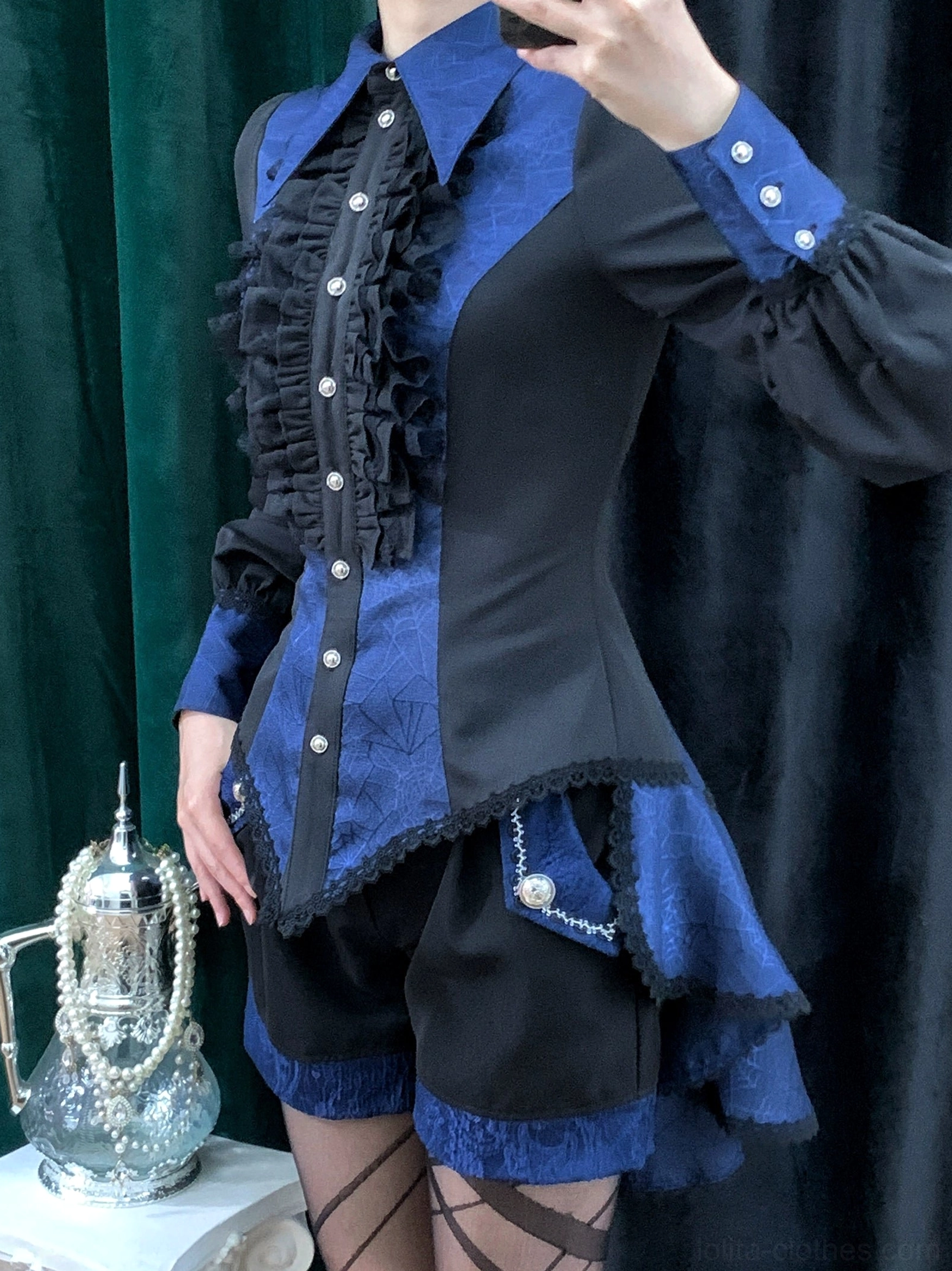 White gothic Ouji lolita spiderweb shirt worn by model showing full coordinate styling with accessories and complementary pieces