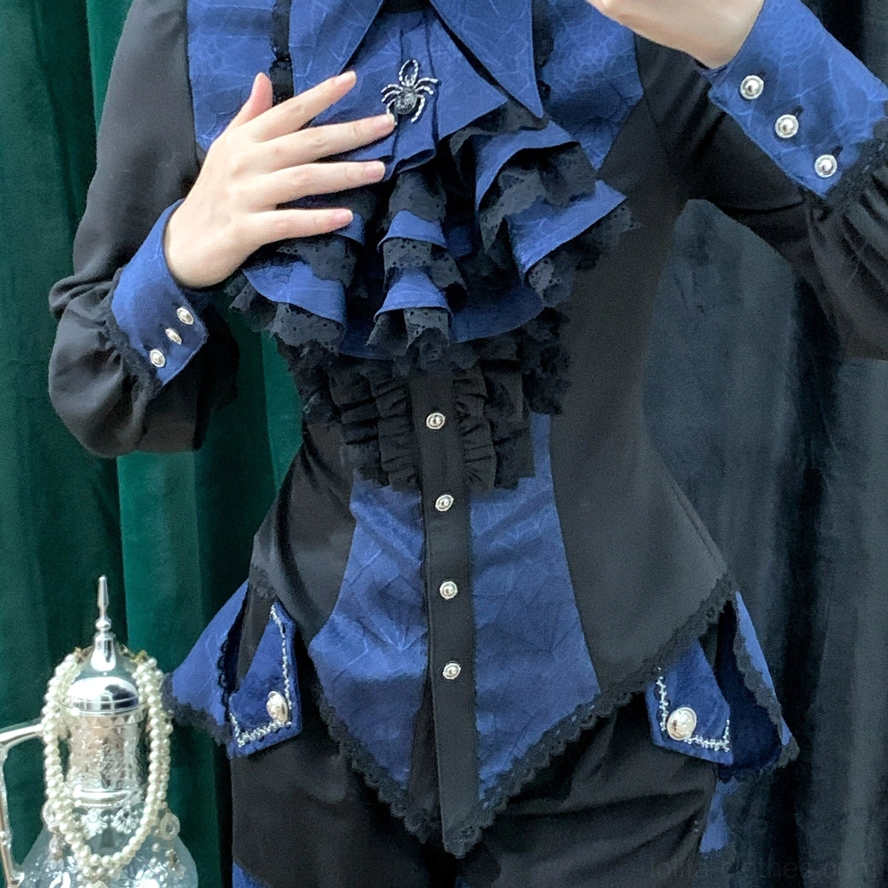 Gothic Ouji lolita spiderweb shirt paired with matching jabot accessory worn by model showing coordinated styling and accessorization