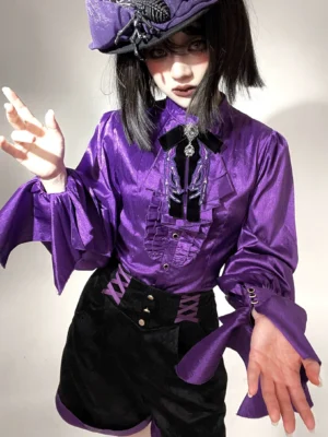 Gothic Ouji Lolita stand-collar shirt front close-up worn by model with purple satin fabric, ruffled front placket, oversized irregular flared cuffs, and decorative neck brooch