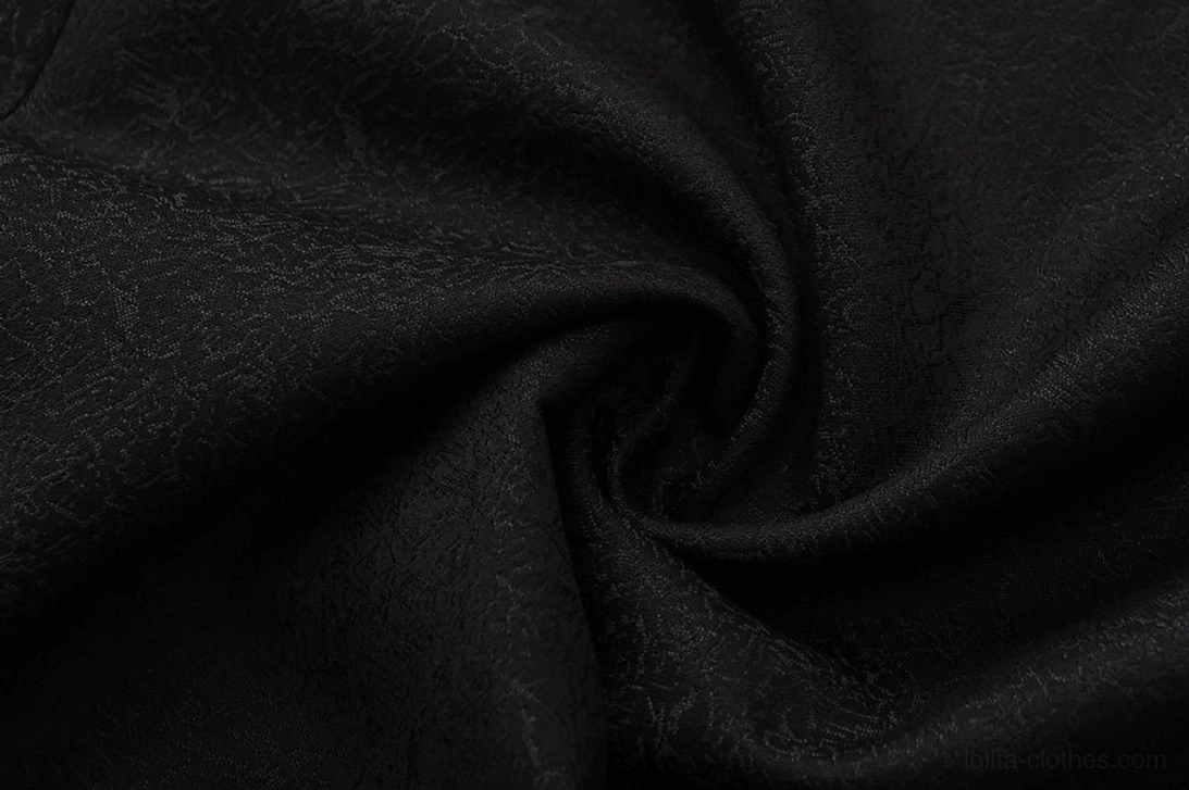 Macro close-up of Ouji Lolita tailcoat outer fabric black jacquard pattern soft drapeable textile composition