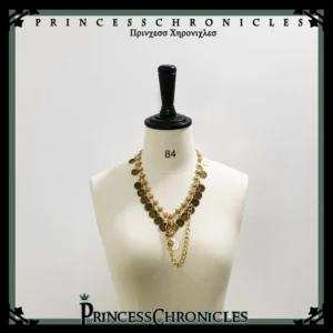 Vintage Ouji Lolita layered gold coin necklace featuring aged bronze coin pendants and twisted gold chains displayed on dress mannequin front view
