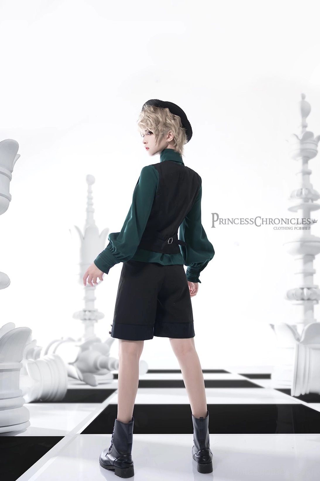 Back view of complete Knight of Rounds Ouji Lolita outfit featuring black sleeveless waistcoat with adjustable buckle system