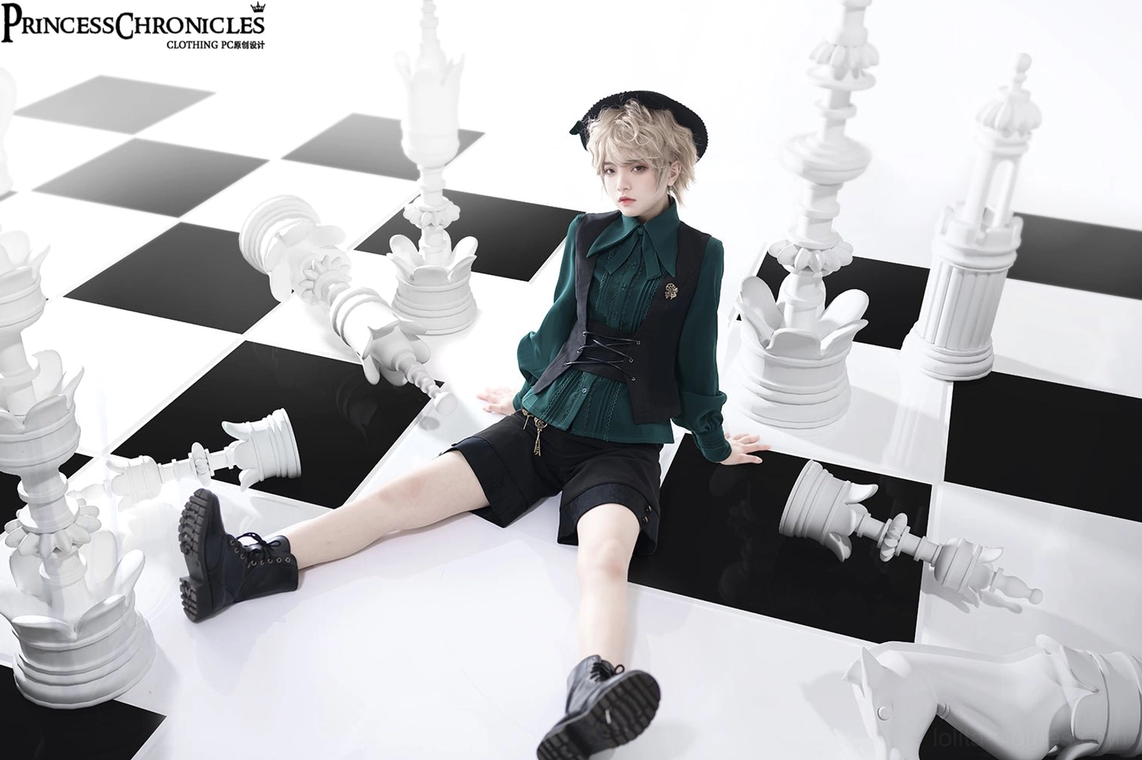 Black Ouji Lolita waistcoat layered styling inspiration over long-sleeve ruffled blouse for complete coordinate aesthetic