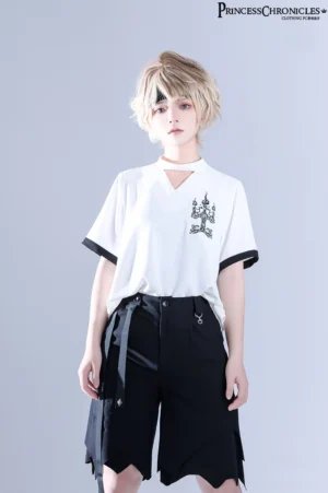 Half-body front close-up of ouji lolita white short-sleeve embroidered shirt showing V-neck choker detail, left chest candelabrum embroidery, black sleeve trim, and high-waisted black shorts with metal hardware