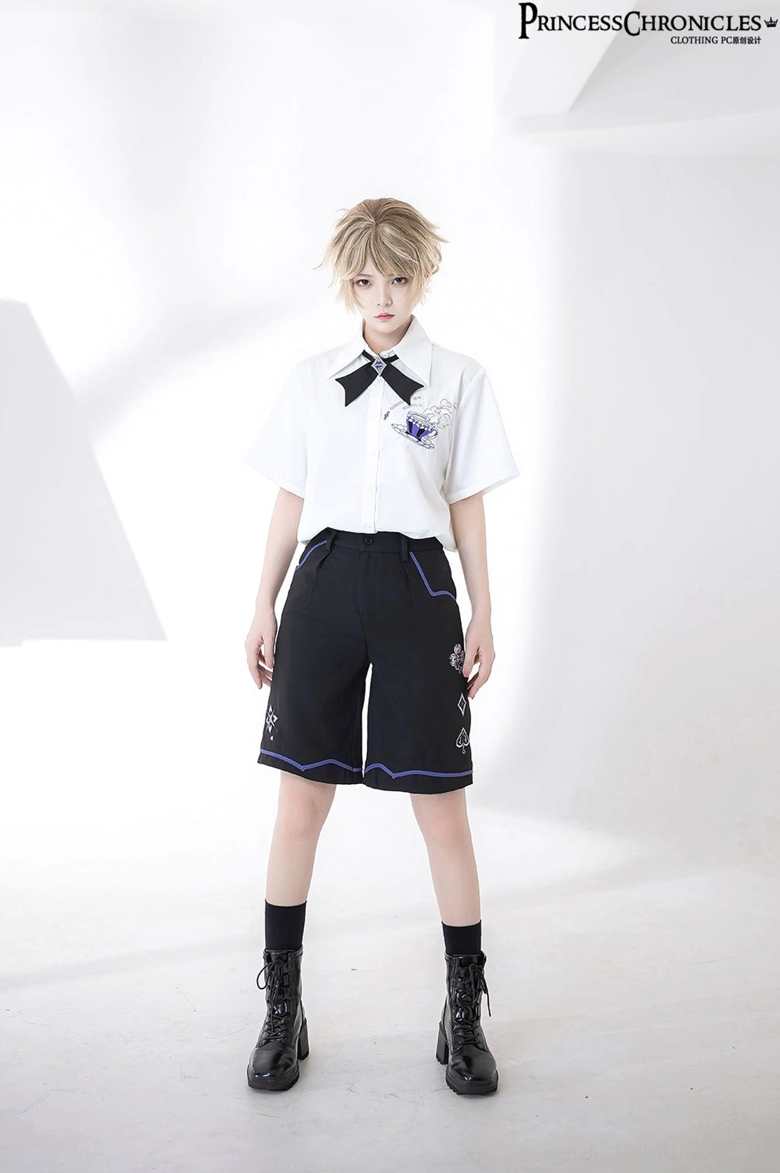 Model in ouji prince embroidered short-sleeve shirt with black bow tie loose lapel collar and coordinating shorts blue-purple decorative lines