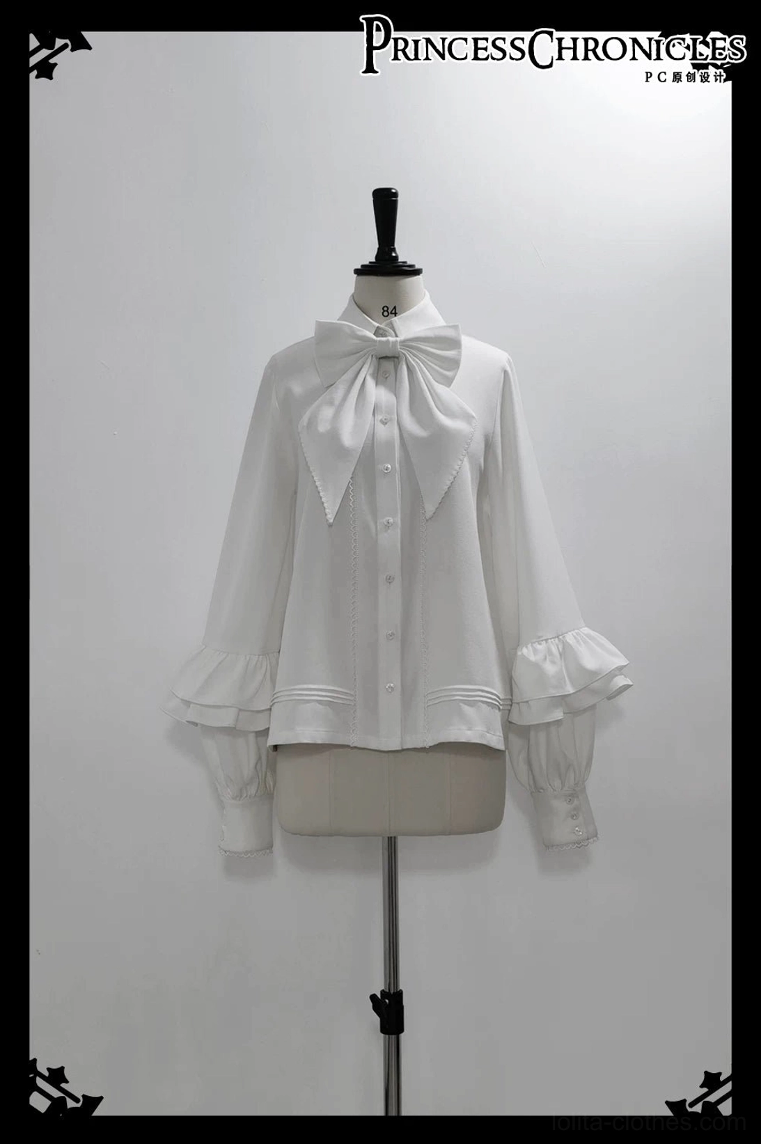 Ouji lolita puff-sleeve white blouse dress form showing large detachable bow necktie flared ruffled cuffs front button closure