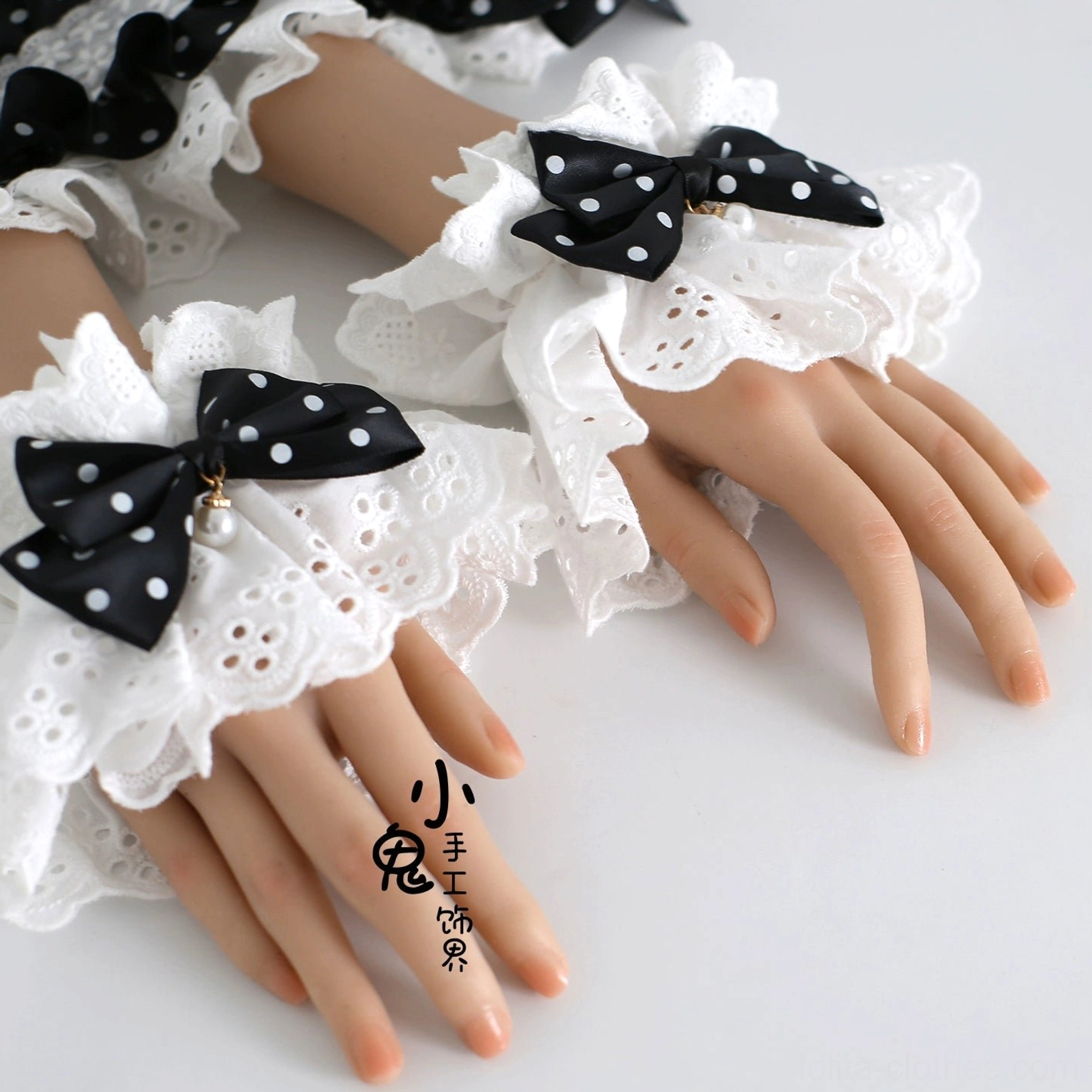 pair lolita cuff accessories polka dot design white ruffled edge black ribbon coordination styling