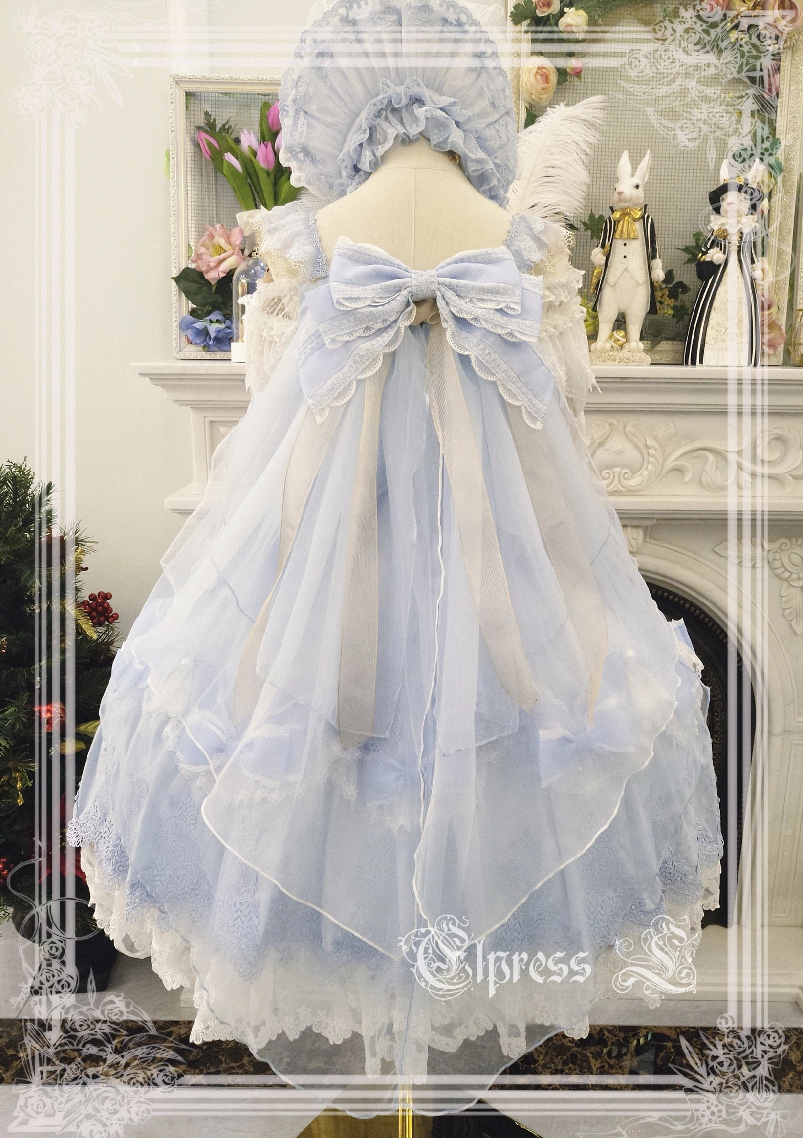 Pale blue-gray lolita JSK jumper skirt dress back view showing gradient organza skirt with lace hem and large satin bow detail Victorian Christmas