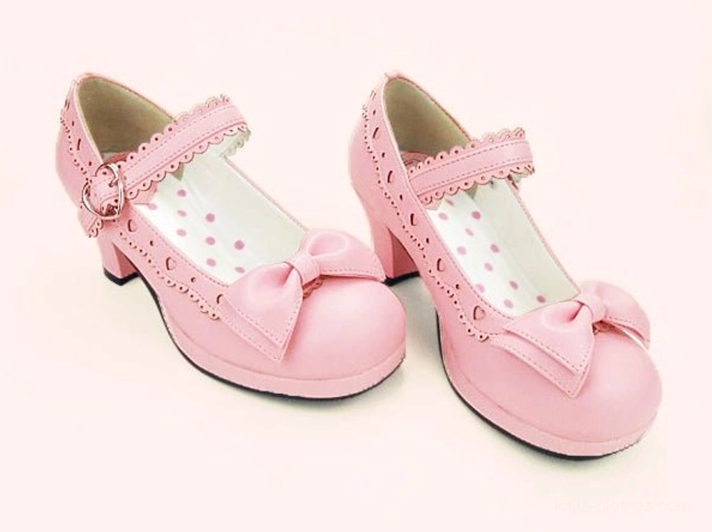 Pale pink lolita mary jane heel shoes three-quarter view with ankle strap and polka dot insole