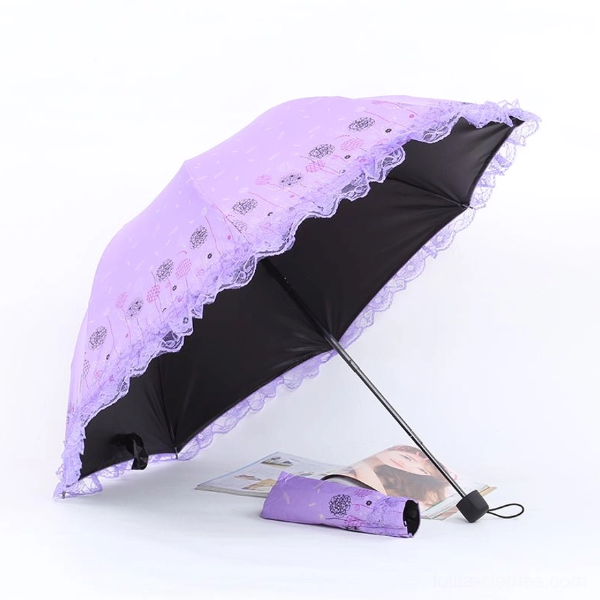 Detailed view of parasol canopy construction showing lace ruffles layering and dimensional ruffled trim work