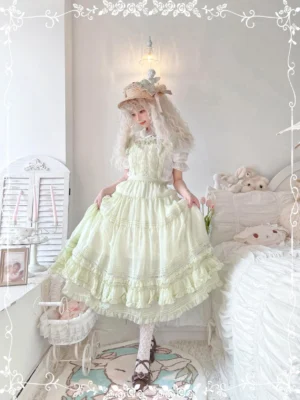 Pastel cyan elegant Lolita salopette dress with tiered ruffled skirt and lace trim in cozy vintage bedroom setting full body front view