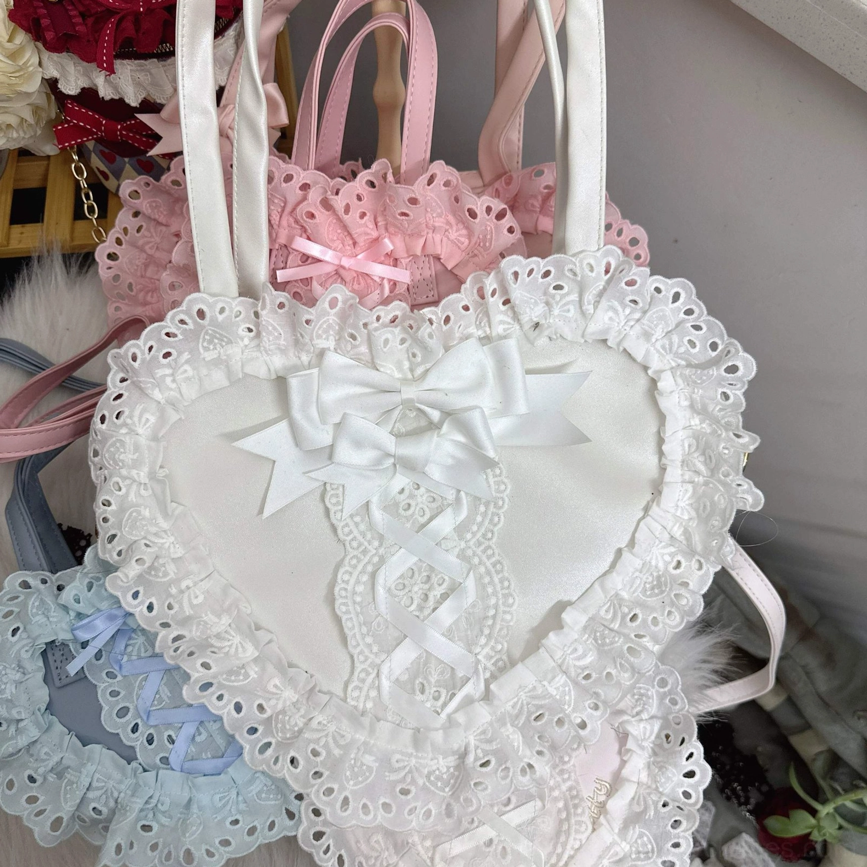 pastel heart-shaped lolita lace handbags front group display white flagship bag with satin bow light blue pink
