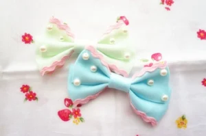 Pastel pearl bow lolita hair clips mint green baby blue side clip scalloped edge faux pearls flat lay strawberry background
