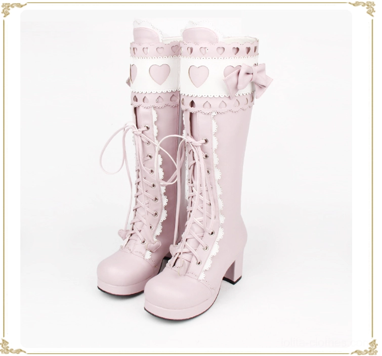 Soft pastel pink sweet lolita mid-calf thick heel boots front flat view on white background with heart details and cross-straps