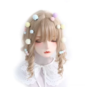 Close-up detailed view of sweet Lolita pompom hair accessories in blue, pink, purple and yellow assorted on styled doll hair