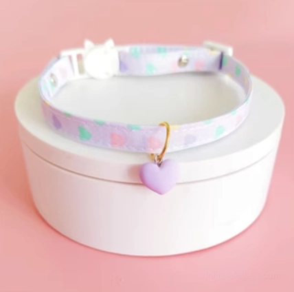Pastel purple heart charm lolita choker with purple webbing pastel heart print design white cat buckle and heart pendant detail