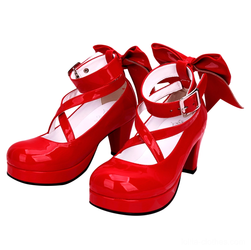 Patent leather red Lolita platform high heel shoes with shiny glossy finish, crossover ankle buckle straps, large decorative back bow, round platform toe, and block heel - front oblique angle