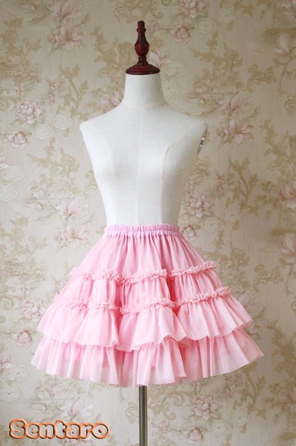 Peach pink tiered ruffle Lolita shorts skirt with multi-layer flounce hem, front view A-line silhouette on dress form