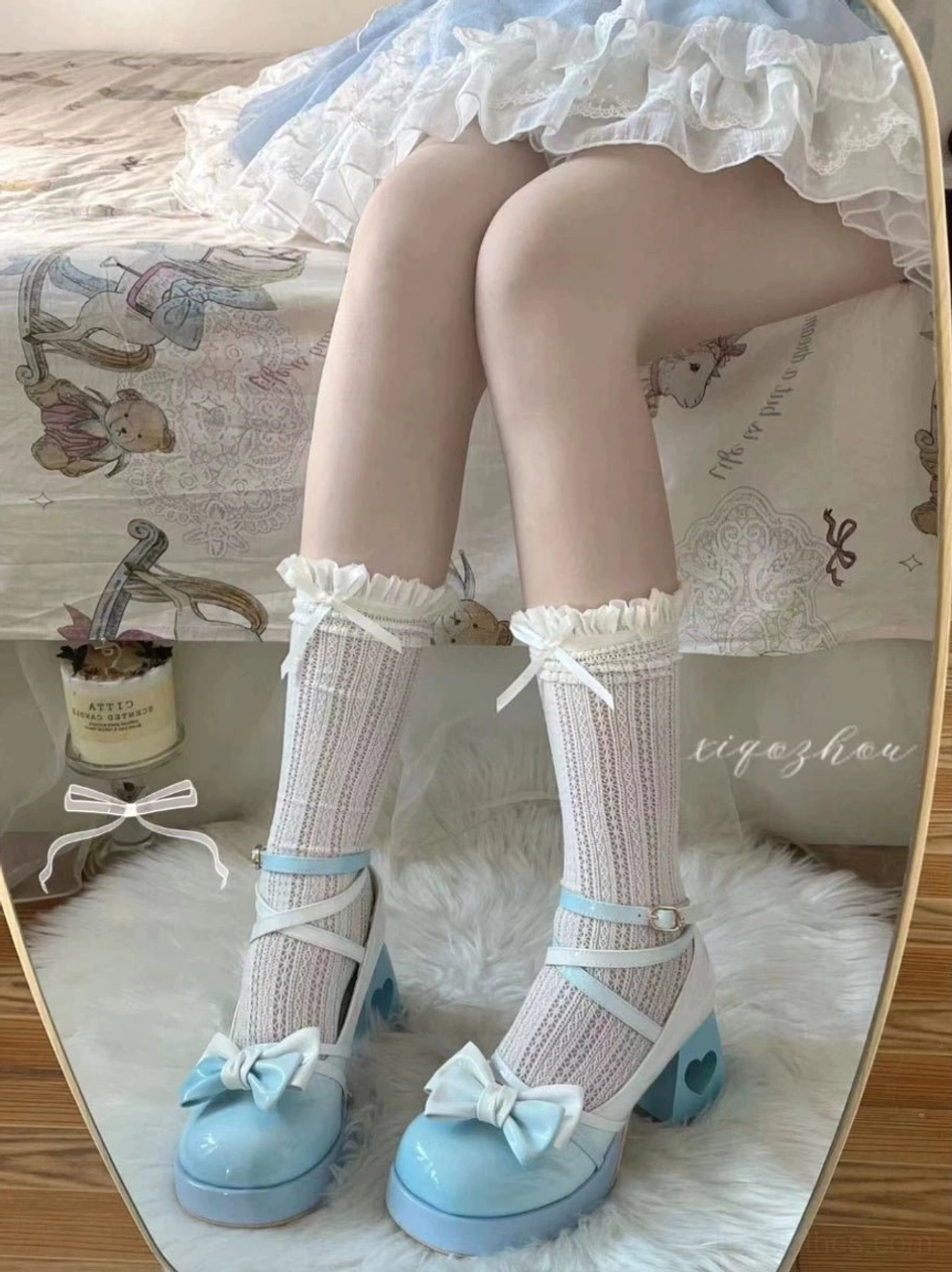 Peacock blue Sweet Lolita platform heels beauty shot highlighting gradient patent leather surface, heart cutout heel design detail, and bow ankle strap embellishment