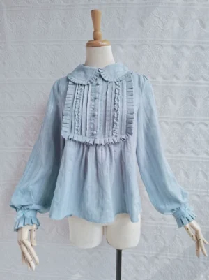 Peacock blue sweet lolita ruffle cotton blouse with peter pan collar displayed on wooden dress mannequin front view showing full design