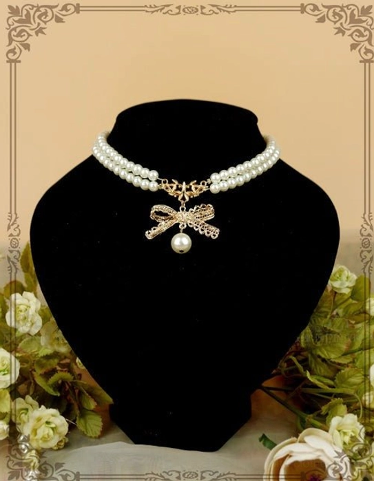 Classic pearl chain bow lolita choker necklace displayed on black jewelry mannequin with white pearl double-layer strands and golden bow charm pendant, vintage floral frame background, front view jewelry photography