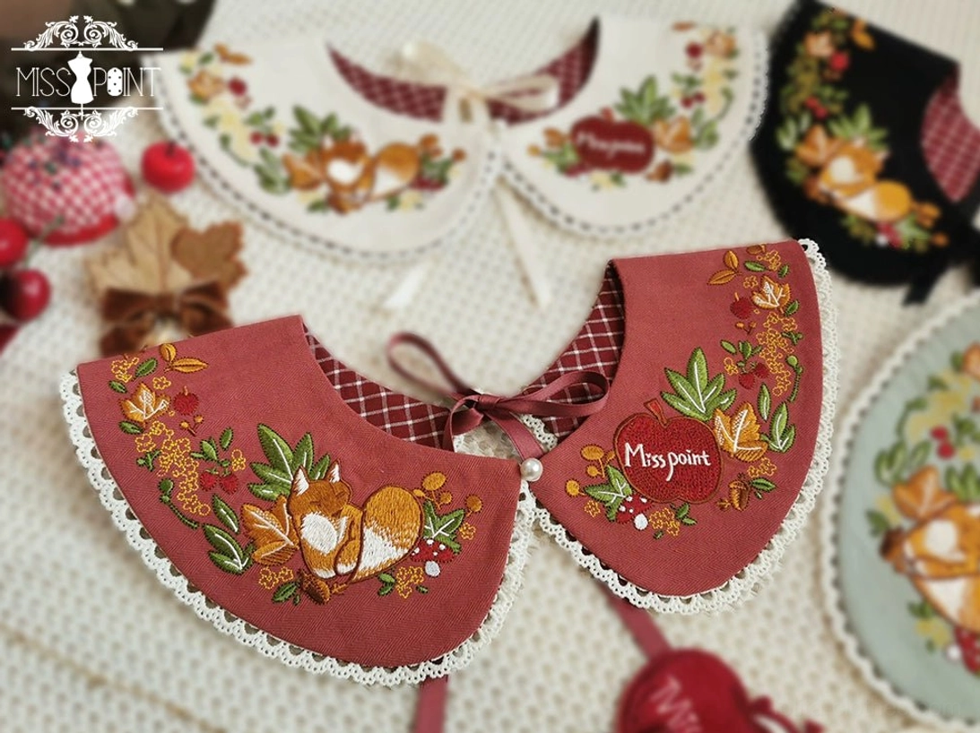 Persimmon red embroidered lolita peter pan faux collar white lace edge trim fox foliage embroidery bow tie fasteners pearl button close-up flat lay