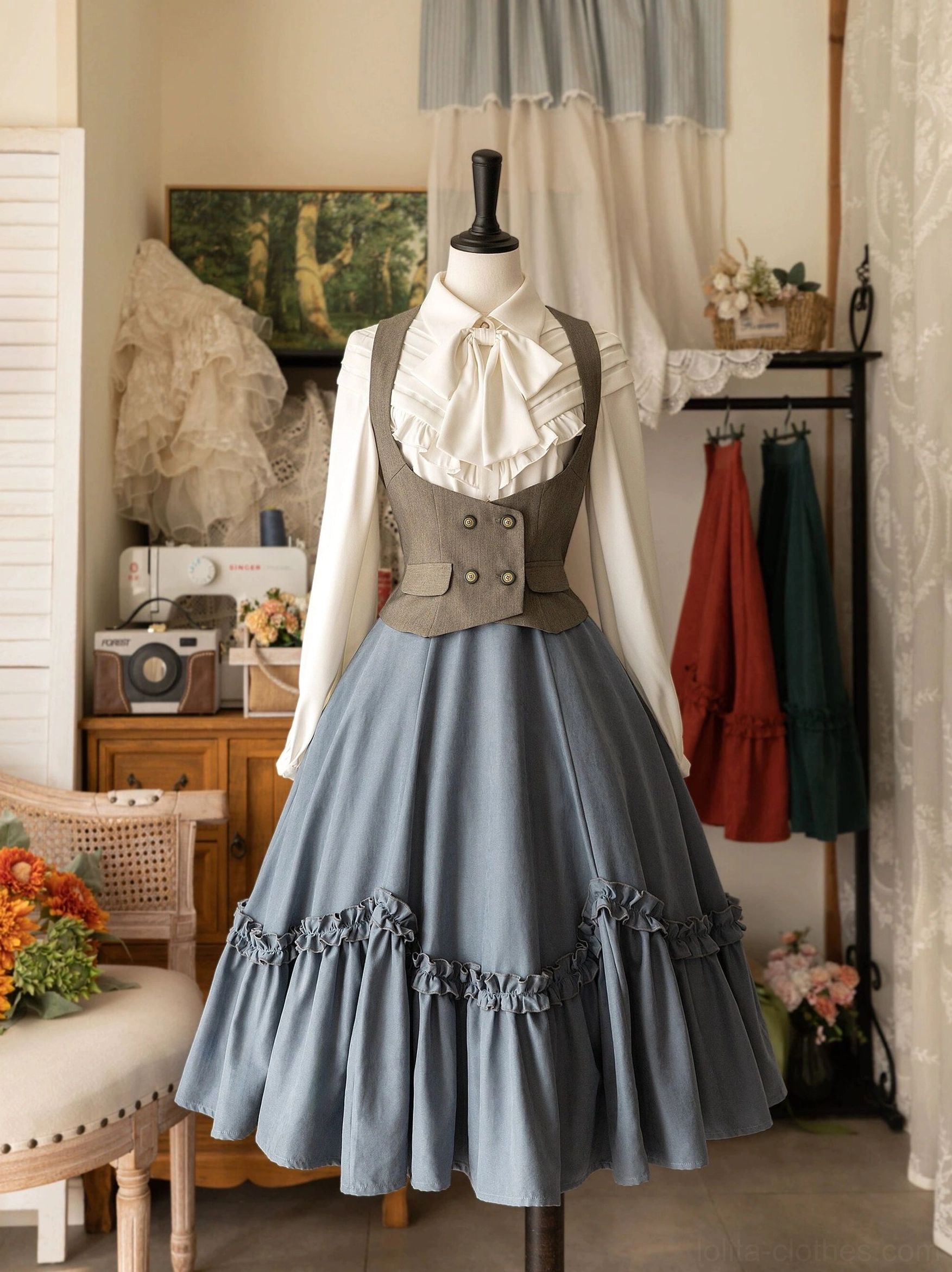 Ivy green petal swing Lolita skirt paired with bow blouse and grey waistcoat on dress mannequin, complete vintage coordinate with detachable white neck bow, boutique interior