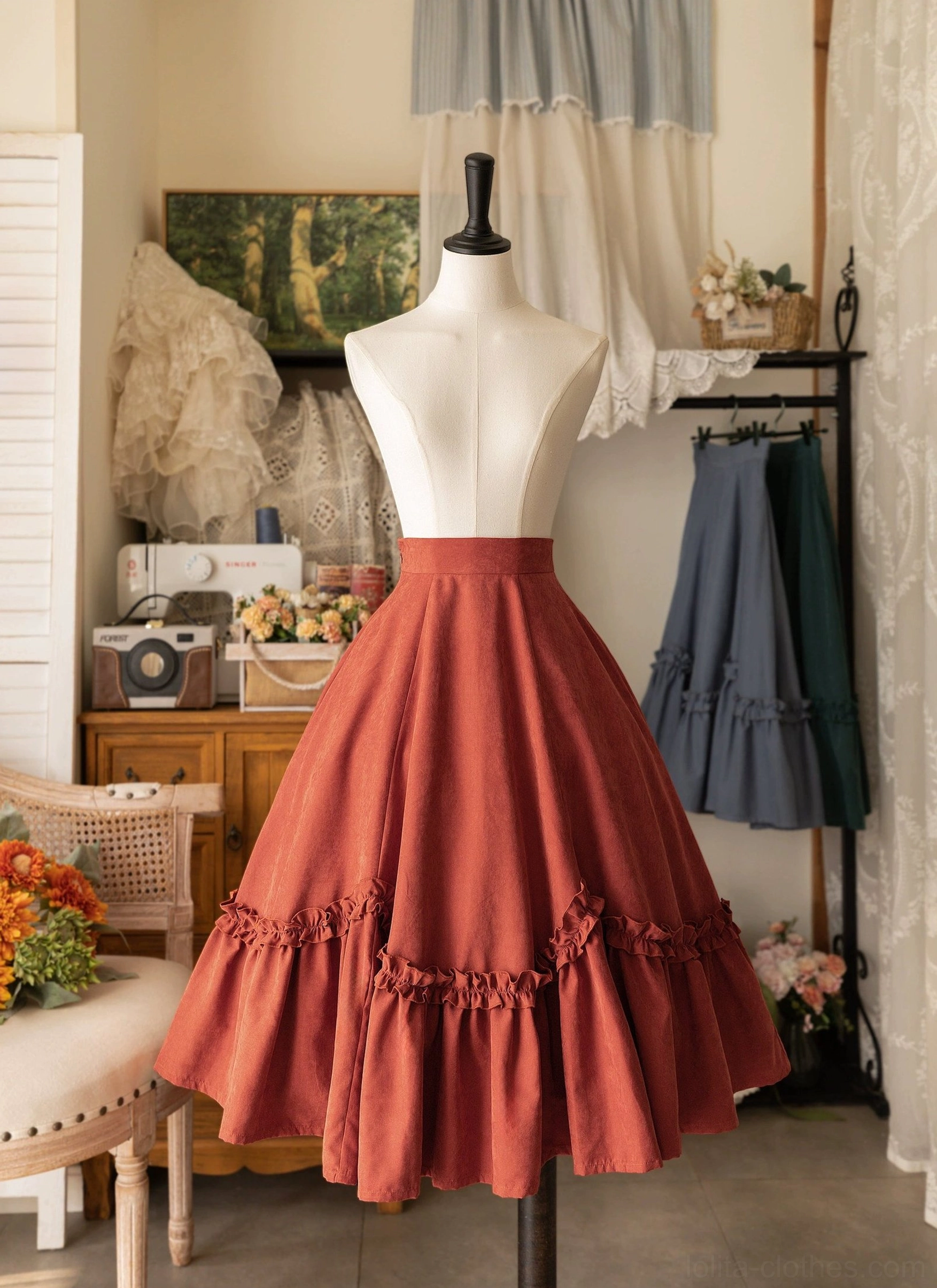 Orange-red petal swing midi Lolita skirt with tiered ruffled hem and high waist shown on dress mannequin, featuring layered petal design and lotus leaf edge detail, vintage boutique setting