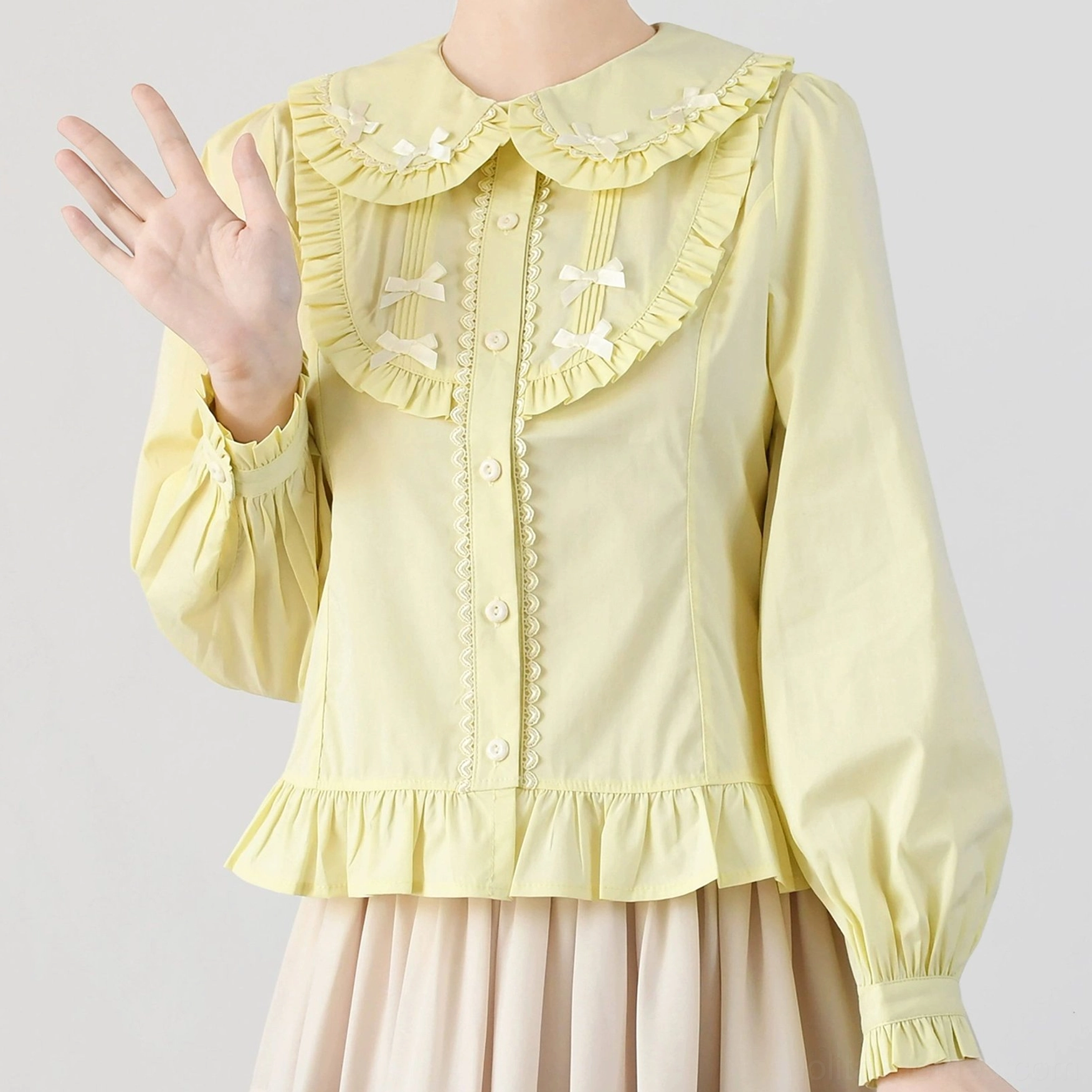 Peter pan doll collar sweet lolita blouse pastel yellow close-up detail lace trim front placket bow accents