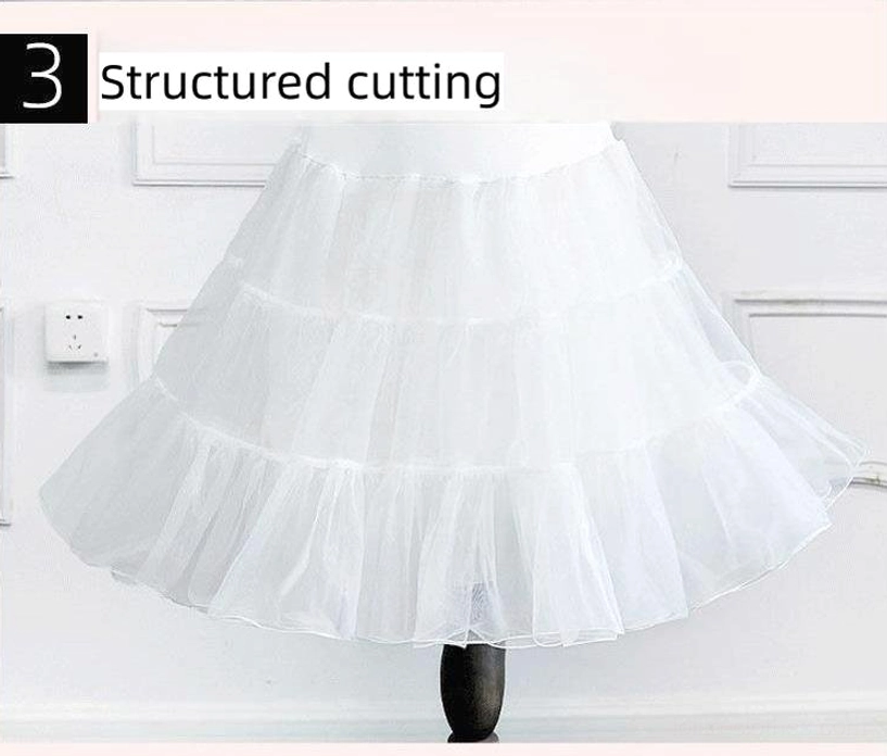 Structured tulle cutting detail of white Lolita petticoat showing layered tulle architecture maintaining puffy A-line shape